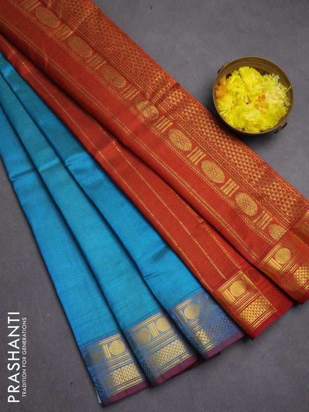 Silk cotton saree teal blue and rustic orange with allover vairosi pattern and zari woven border
