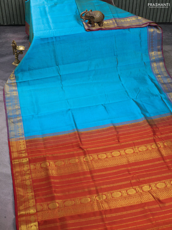 Silk cotton saree teal blue and rustic orange with allover vairosi pattern and zari woven border