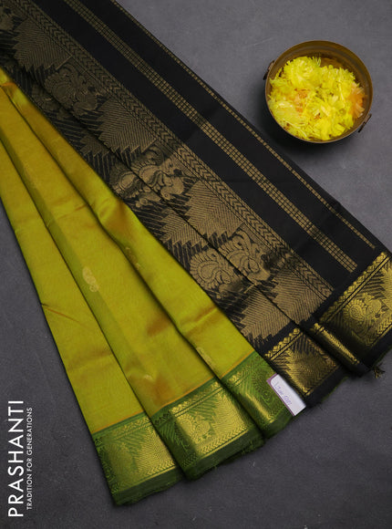 Silk cotton saree dual shade of lime green and black with zari woven buttas and annam & temple zari woven border