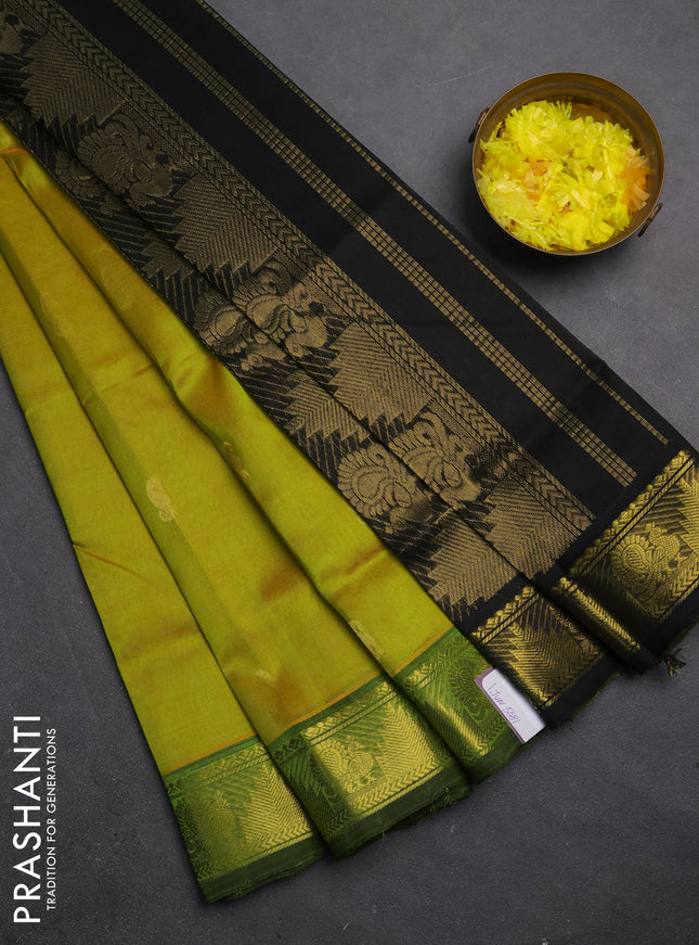 Silk cotton saree dual shade of lime green and black with zari woven buttas and annam & temple zari woven border