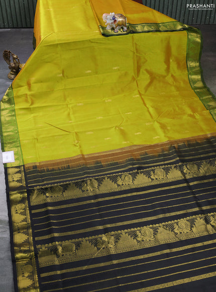 Silk cotton saree dual shade of lime green and black with zari woven buttas and annam & temple zari woven border