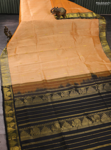 Silk cotton saree pale orange and black with zari woven buttas and annam & temple zari woven border