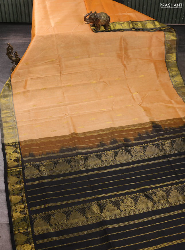Silk cotton saree pale orange and black with zari woven buttas and annam & temple zari woven border