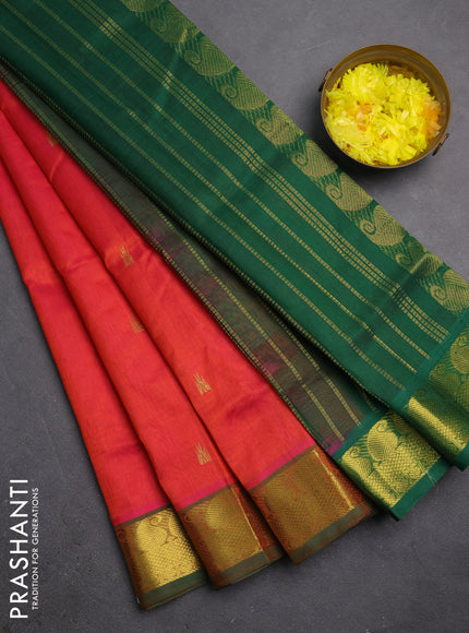 Silk cotton saree dual shade of pinkish orange and green with temple zari woven buttas and paisley zari woven border