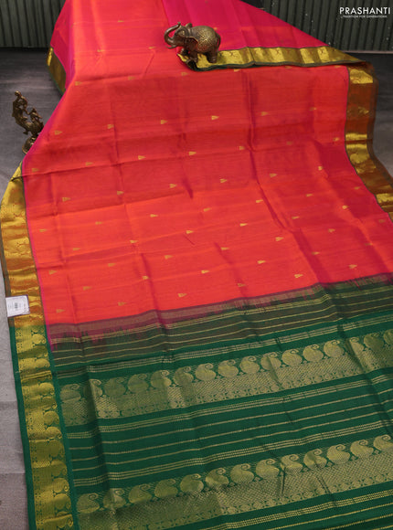 Silk cotton saree dual shade of pinkish orange and green with temple zari woven buttas and paisley zari woven border