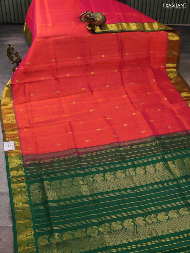 Silk cotton saree dual shade of pinkish orange and green with temple zari woven buttas and paisley zari woven border