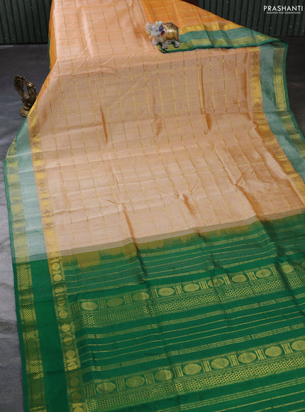 Silk cotton saree pale orange and green with allover zari checked pattern and rettapet zari woven border