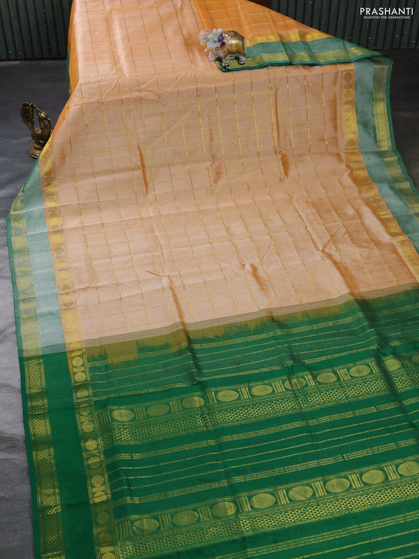 Silk cotton saree pale orange and green with allover zari checked pattern and rettapet zari woven border