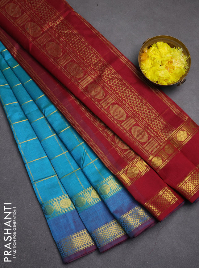 Silk cotton saree dual shade of teal bluish green and maroon with allover zari checked pattern and rettapet zari woven border