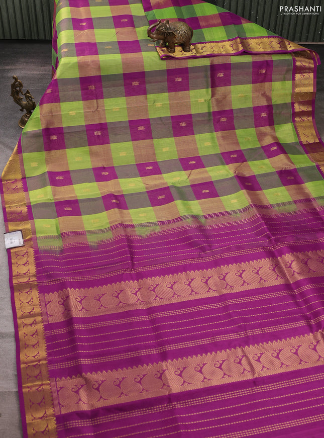 Silk cotton saree green and purple with allover paalum pazhamum checks & zari buttas and paisley zari woven border