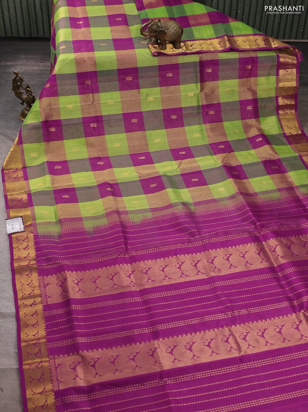 Silk cotton saree green and purple with allover paalum pazhamum checks & zari buttas and paisley zari woven border