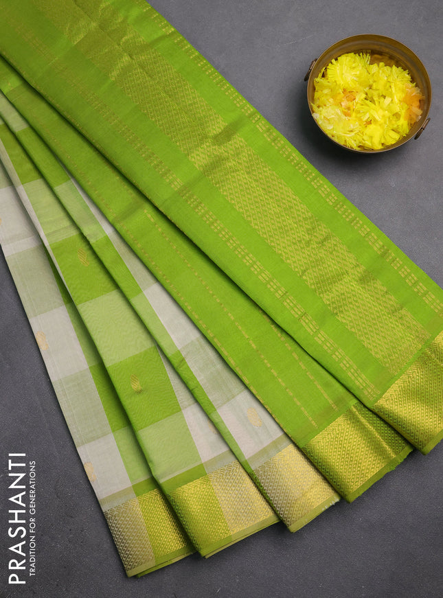 Silk cotton saree cream and light green with allover paalum pazhamum checks & zari buttas and zari woven border