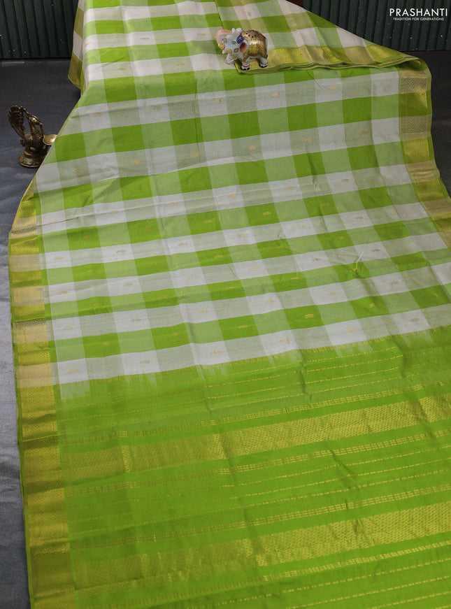 Silk cotton saree cream and light green with allover paalum pazhamum checks & zari buttas and zari woven border