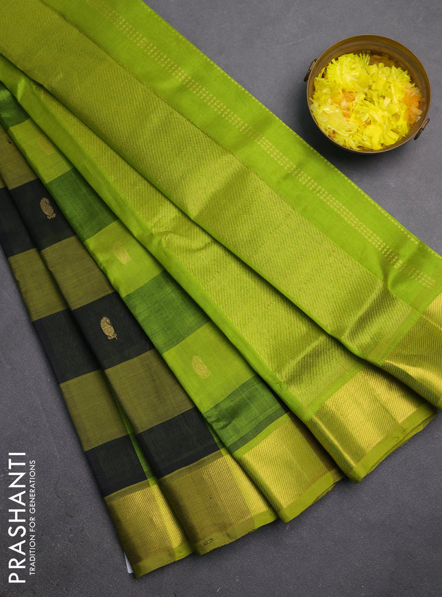 Silk cotton saree black and light green with allover paalum pazhamum checks & zari buttas and zari woven border