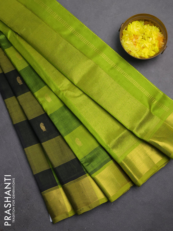 Silk cotton saree black and light green with allover paalum pazhamum checks & zari buttas and zari woven border