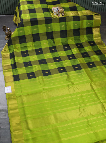 Silk cotton saree black and light green with allover paalum pazhamum checks & zari buttas and zari woven border