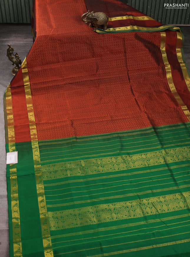 Silk cotton saree rust shade and green with allover lakshadeepam weaves and rettapet zari woven border