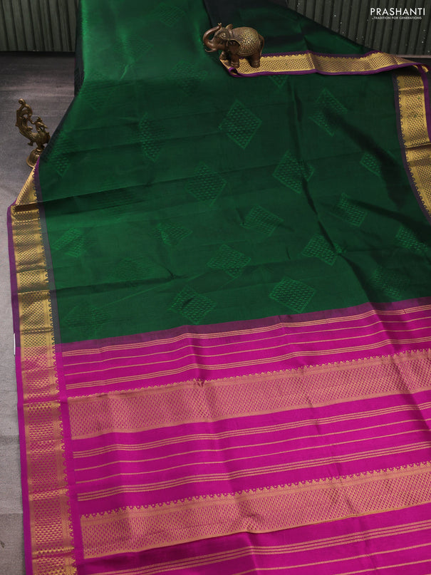 Silk cotton saree bottle green and purple with allover self emboss jacquard and zari woven border