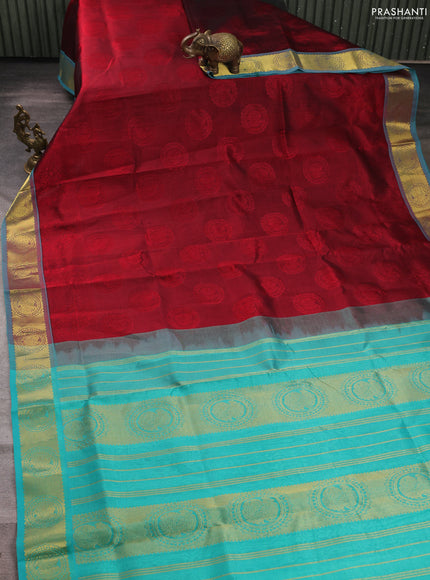 Silk cotton saree maroon and teal blue with allover self emboss jacquard and annam zari woven border