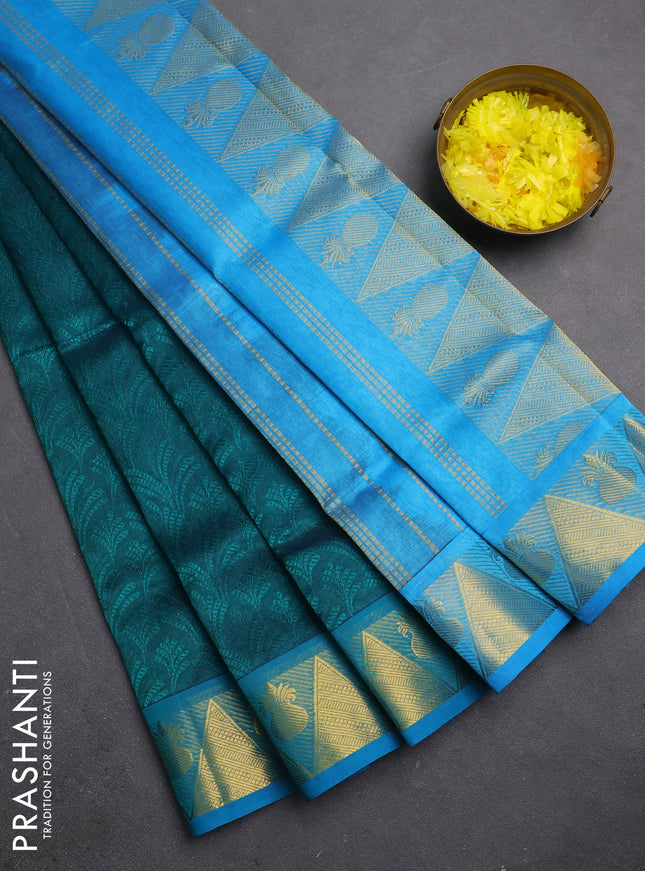Silk cotton saree peacock green and cs blue with allover self emboss jacquard and zari woven border