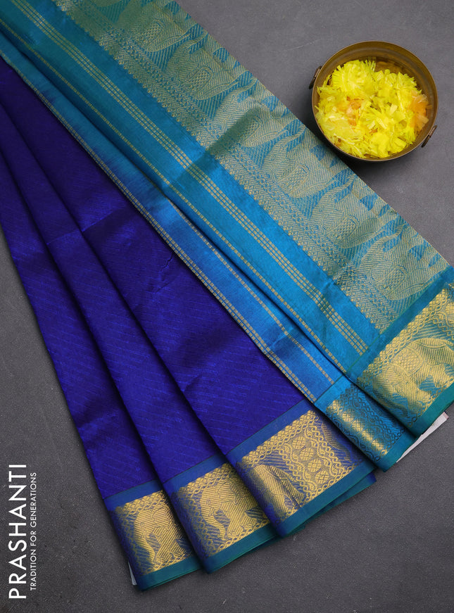 Silk cotton saree blue and dual shade of teal bluish green with allover self emboss jacquard and elephant zari woven border