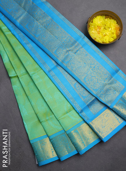 Silk cotton saree dual shade of pista green and light blue with allover self emboss jacquard and zari woven border