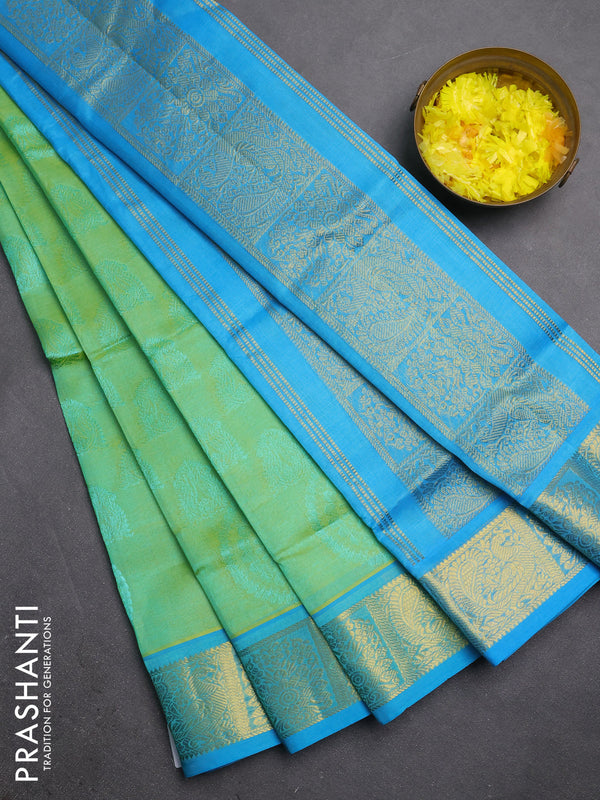 Silk cotton saree dual shade of pista green and light blue with allover self emboss jacquard and zari woven border