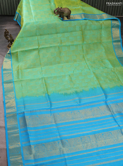 Silk cotton saree dual shade of pista green and light blue with allover self emboss jacquard and zari woven border