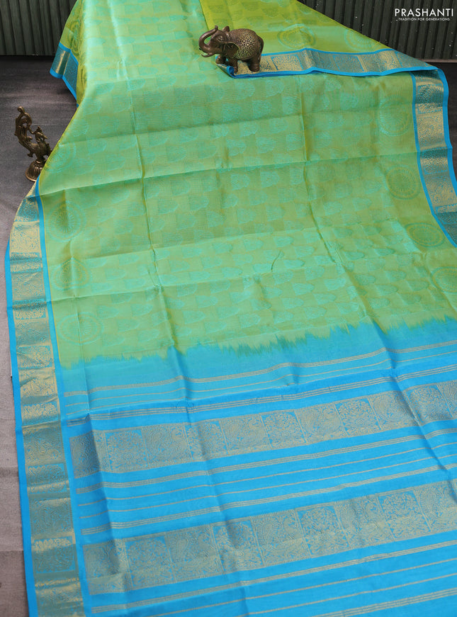 Silk cotton saree dual shade of pista green and light blue with allover self emboss jacquard and zari woven border