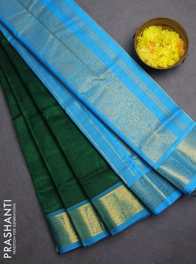 Silk cotton saree green and light blue with allover self emboss jacquard and zari woven border