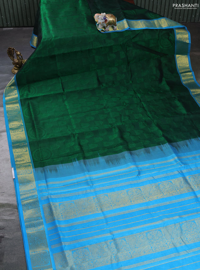 Silk cotton saree green and light blue with allover self emboss jacquard and zari woven border