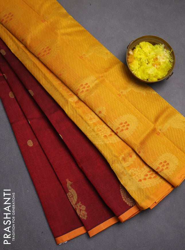 Silk cotton saree maroon and mango yellow with zari woven buttas and peacock zari woven butta border