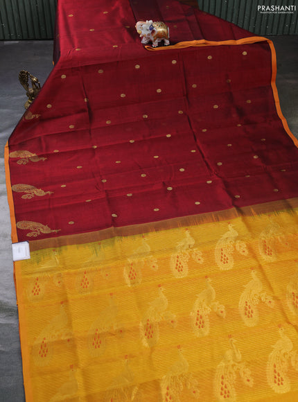 Silk cotton saree maroon and mango yellow with zari woven buttas and peacock zari woven butta border