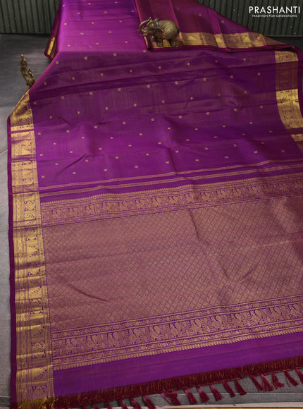 Pure kanchipurams silk saree purple with allover vairaosi pattern & zari buttas and temple & paisley zari woven border