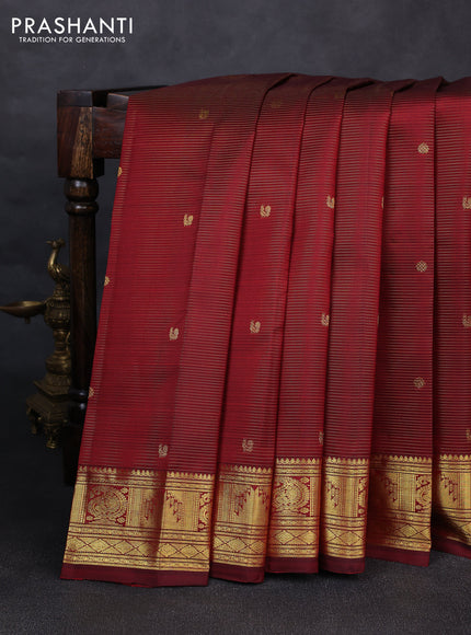Pure kanchipurams silk saree maroon with allover vairaosi pattern & zari buttas and temple & paisley zari woven border