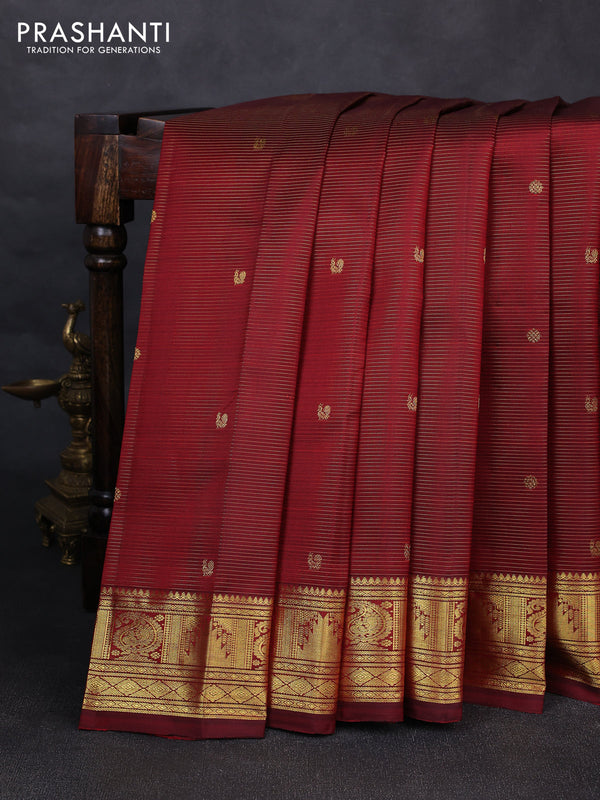 Pure kanchipurams silk saree maroon with allover vairaosi pattern & zari buttas and temple & paisley zari woven border