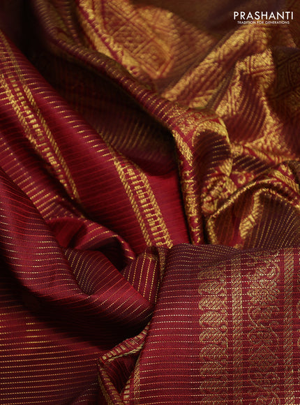 Pure kanchipurams silk saree maroon with allover vairaosi pattern & zari buttas and temple & paisley zari woven border