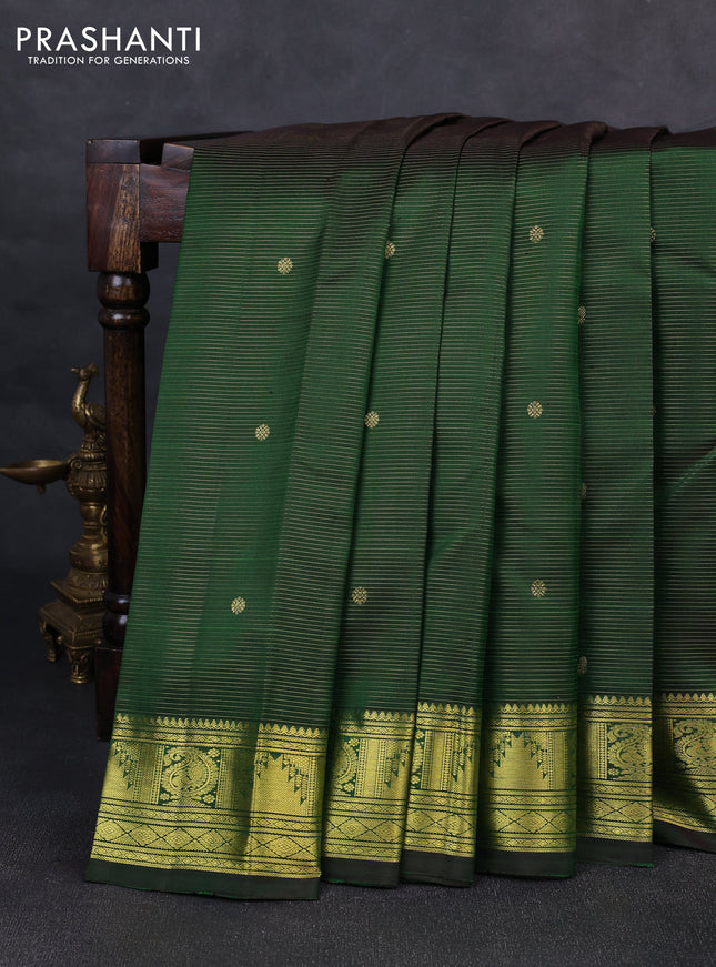 Pure kanchipurams silk saree green with allover vairaosi pattern & zari buttas and temple & paisley zari woven border