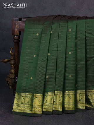 Pure kanchipurams silk saree green with allover vairaosi pattern & zari buttas and temple & paisley zari woven border