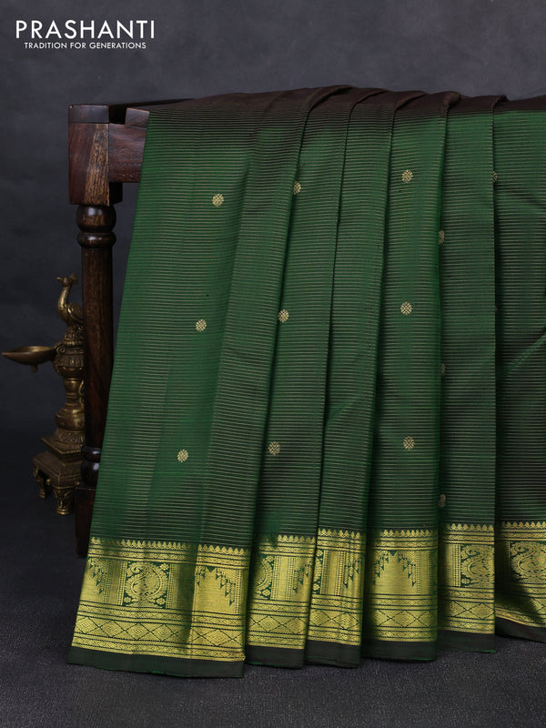 Pure kanchipurams silk saree green with allover vairaosi pattern & zari buttas and temple & paisley zari woven border