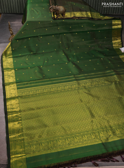 Pure kanchipurams silk saree green with allover vairaosi pattern & zari buttas and temple & paisley zari woven border