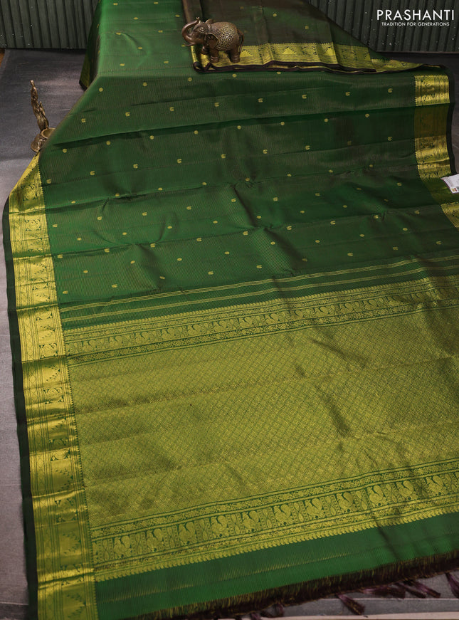 Pure kanchipurams silk saree green with allover vairaosi pattern & zari buttas and temple & paisley zari woven border
