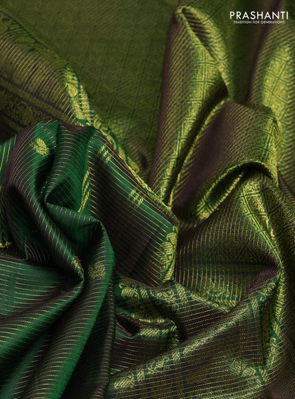 Pure kanchipurams silk saree green with allover vairaosi pattern & zari buttas and temple & paisley zari woven border