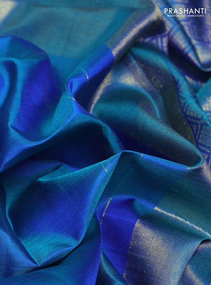 Pure kanchipurams silk saree dual shade of bluish green and purple with zari woven buttas and temple design zari woven border
