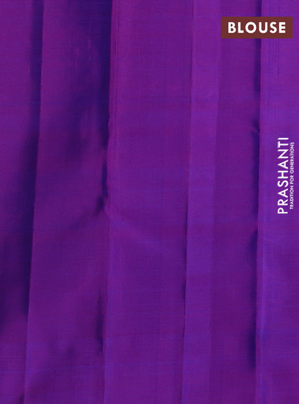Pure kanchipurams silk saree dual shade of bluish green and purple with zari woven buttas and temple design zari woven border