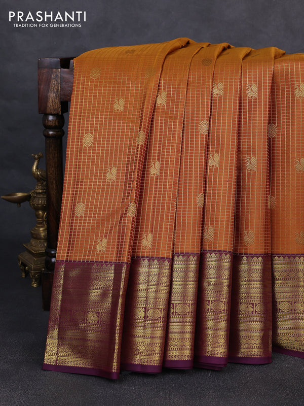 Pure kanchipurams silk saree dark mustard and purple with allover small checks & buttas and rich zari woven border