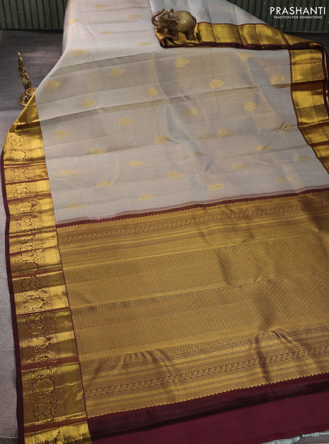 Pure kanchipurams silk saree grey and coffee brown with allover small checks & buttas and rich zari woven border