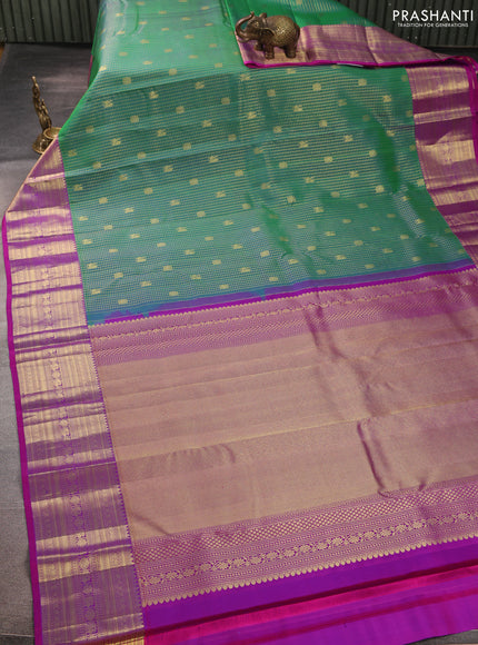 Pure kanchipurams silk saree teal green and purple with allover small zari checks & buttas and long zari woven border