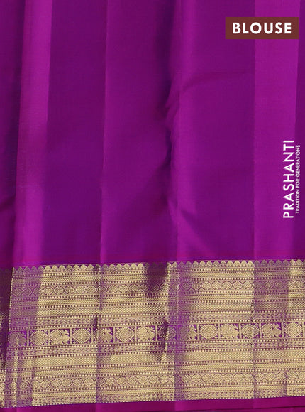 Pure kanchipurams silk saree teal green and purple with allover small zari checks & buttas and long zari woven border