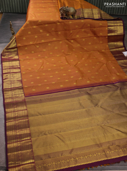 Pure kanchipurams silk saree dark mustard and deep purple with allover small zari checks & buttas and long zari woven border